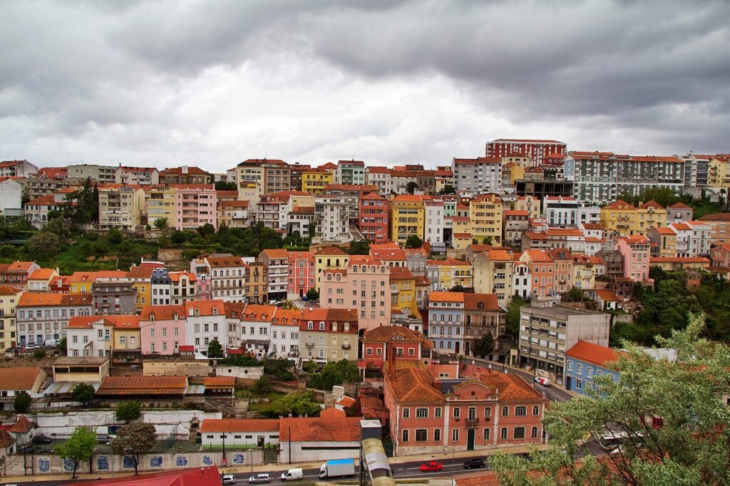 orange roof buildings in coimbra city portugal